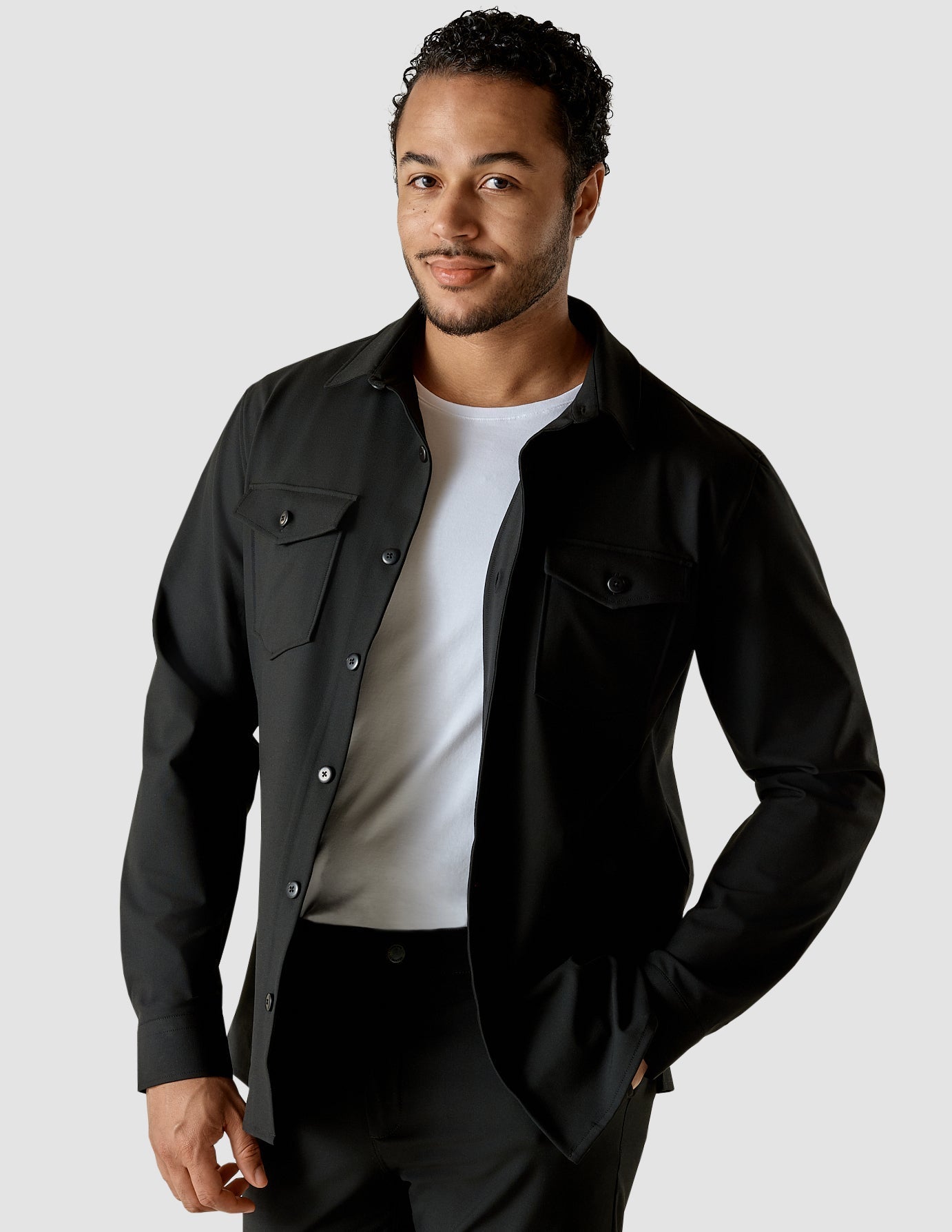Model from the front wearing a Black overshirt with a white t-shirt